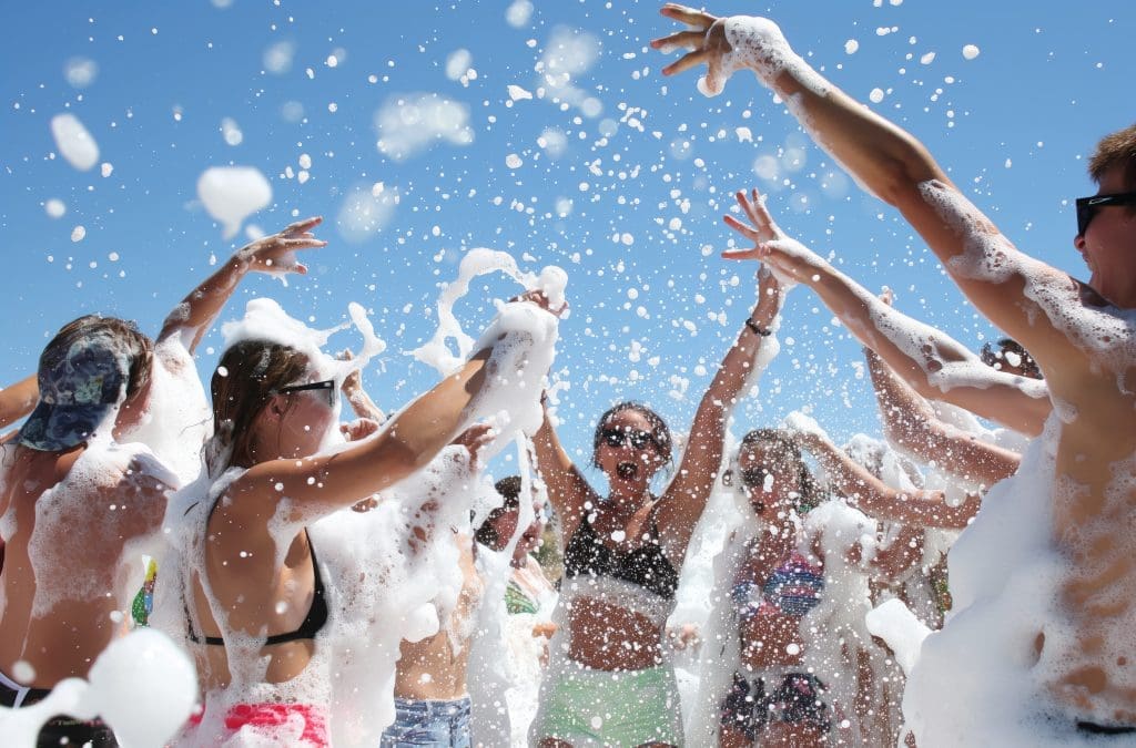 Tourists dancing in foam during Alanya pirate boat foam party