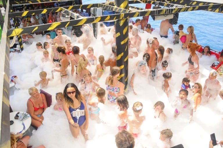 Tourists enjoying a foam party during the Alanya pirate boat tour