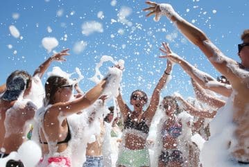 Tourists dancing in foam during Alanya pirate boat foam party