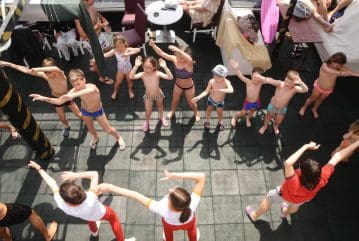 Children enjoying dance animation on pirate boat in Alanya