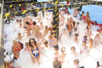 Tourists enjoying a foam party during the Alanya pirate boat tour